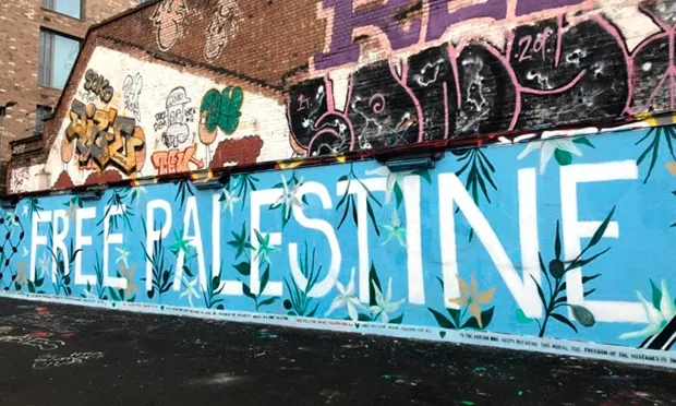 ‘It’s about humanity’: Pro-Palestinian campaigners defend graffiti on Hackney border following complaint