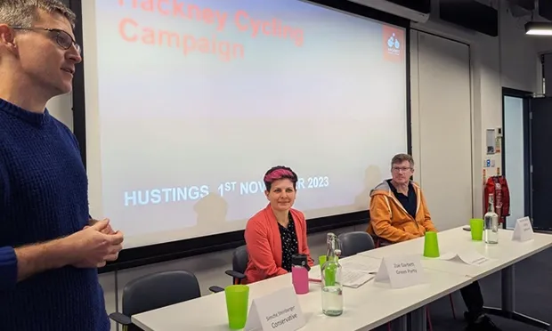 Hackney Cycling Campaign co-ordinator Garmon ap Garth introduces mayoral hustings, with Zoë Garbett, Green, and Simon de Dene