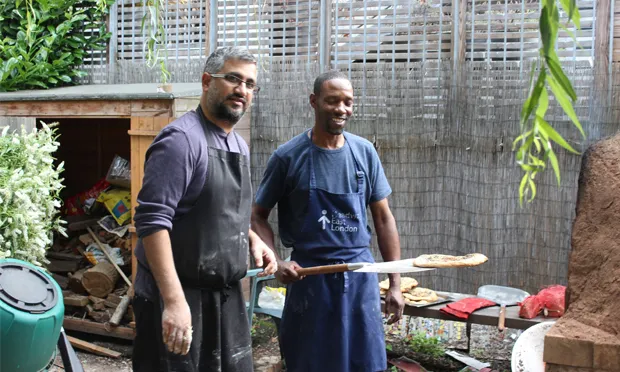 Cook-out: Headway East London's Zuber Haji and brain injury survivor Keith share bread-making duties. Photographs: Jade King