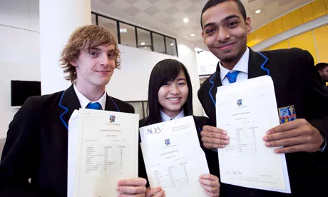 Students Joe Martin, Sweet Lordson and Jabedur Rahman with their GCSE results