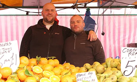 Market economics: Matt Fawcett (L), Jason Julian (R) at their stall, Ridley Road Market. Photograph: Hackney Citizen