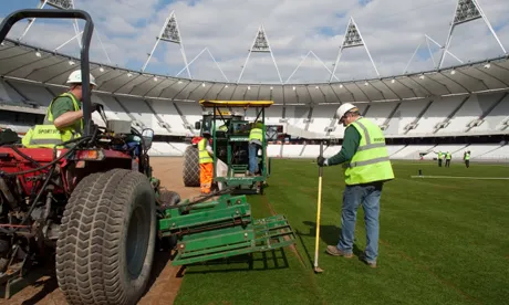 The best laid plans: new turf is put down in the Olympic Stadium. Photo: ODA