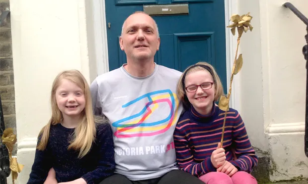Marathon man: Adrian Peacock with his two daughters