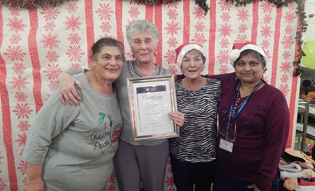 Sheila Bryant, a volunteer who received an award in December 2016 for 25 years service, pictured at a festive party alongside