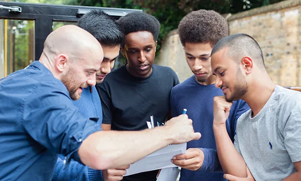 Students at Stoke Newington School collect their results