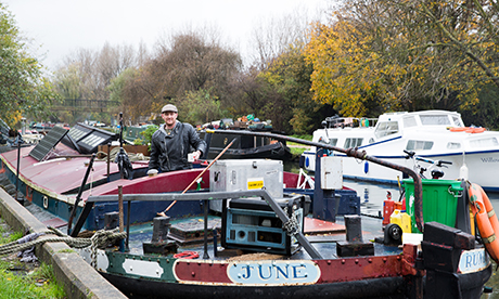 Damian Walsh on his boat ‘June’ currently moored in Lower Clapton. Photograph: Eleonore de Bonneval