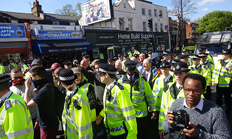 Police escorting the group in Upper Clapton. Photograph: Dean Ryan