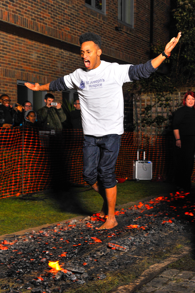 Firewalking feat: Rhasan Brunner crosses the coals