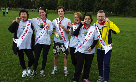  WORLDwrite volunteers show off their medals at a sponsored run event held to raise money for its Freedom to Film campaign. Photograph: WORLDwrite