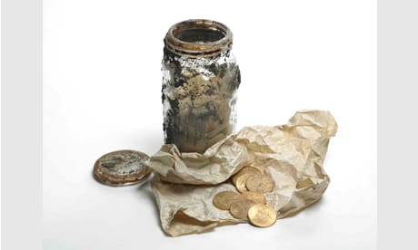 Gold coins and glass jar