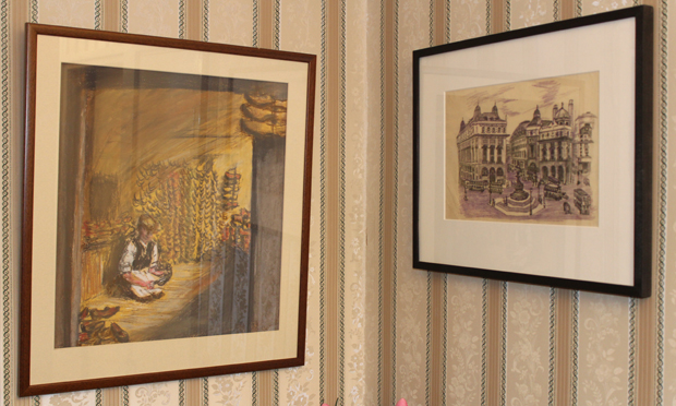 The original of Piccadilly Circus (right) hangs on Gosnell's Woodberry Down flat