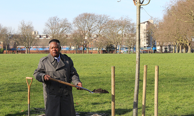 John Burke-Monerville planting the tree for his son. Photograph: Nell Lewis