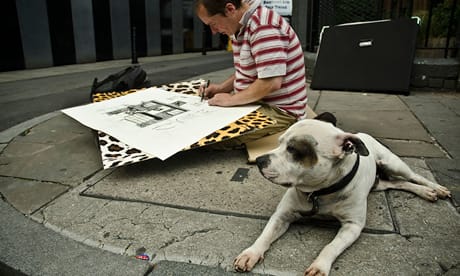 Mr Dolan drawing on a Shoreditch Street with his dog George