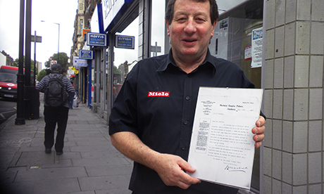 John Harris with the letter from the Hackney Empire to his grandfather. Photograph: Josh Loeb