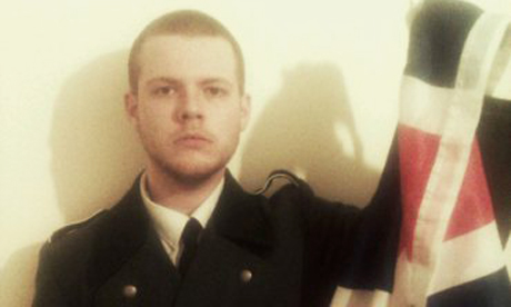 Joshua Bonehill in uniform with flag 460 x 276