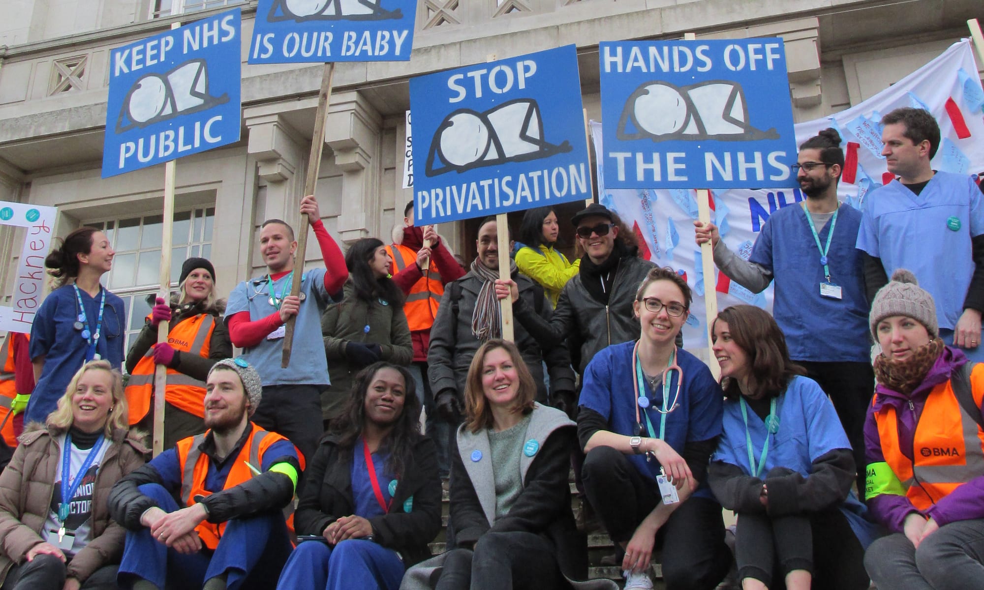 Protest: Junior doctors and artist Stik (centre) outside Hackney Town Hall. Photograph: Stik