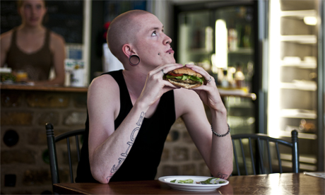 The ‘Punk’ burger, made from tofu and pumpkin, is served with potato wedges and salad. Photo: Tanja Schimpl