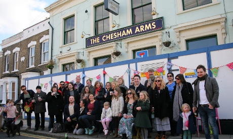Cheers: Chesham Arms campaigners outside the pub on Metahebal Road
