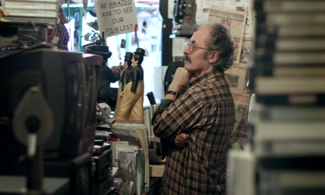 Ümit Mesut looks over the stock in his film emporium. Photograph: Liam Saint-Pierre